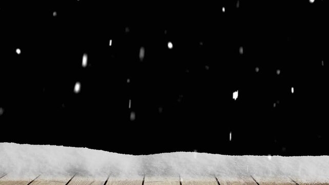 Snow falls on a wooden floor with a pile of snow