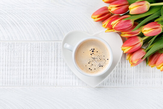 Coffee and fresh tulips