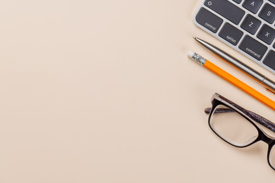 Office supplies on beige desk