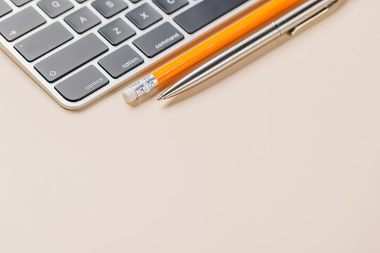 Office supplies on beige desk