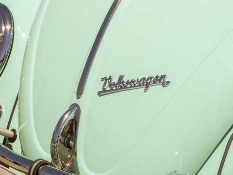 Close-up of a mint green classic Volkswagen Beetle at a car show in Ruston - June 13, 2026 Ruston WA, USA