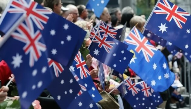 Crowd of people waving australian flags during a public celebration