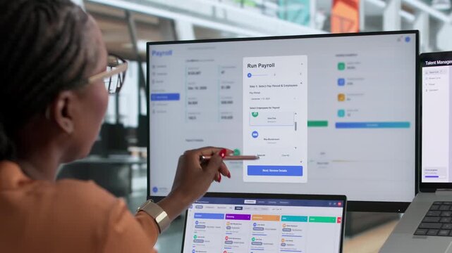 HR Manager Carefully Reviews Payroll Software