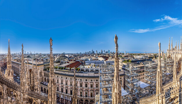 The Milan cathedral rooftop features the largest walkable Gothic roof in the world and the iconic gold Madonnina statue