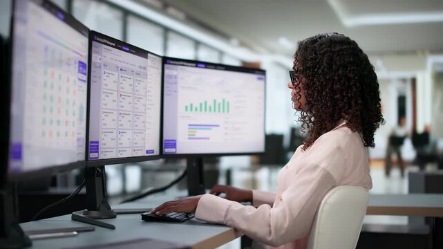 Procurement Manager Analyzes Supplier Bids On Computer