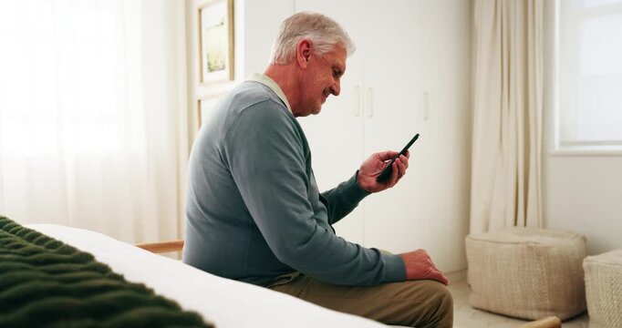 Senior, man and smile in retirement home with phone, reading news and notification for text message. Happy, elderly person and browsing in bedroom with tech, social media post and digital article.