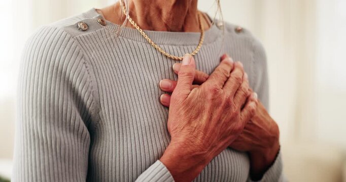 Senior, woman or hands with chest pain in home for cardiac arrest, heart attack or breathing cramp. Elderly, female person or sore ache with disease for chronic stress, pneumonia or illness in house