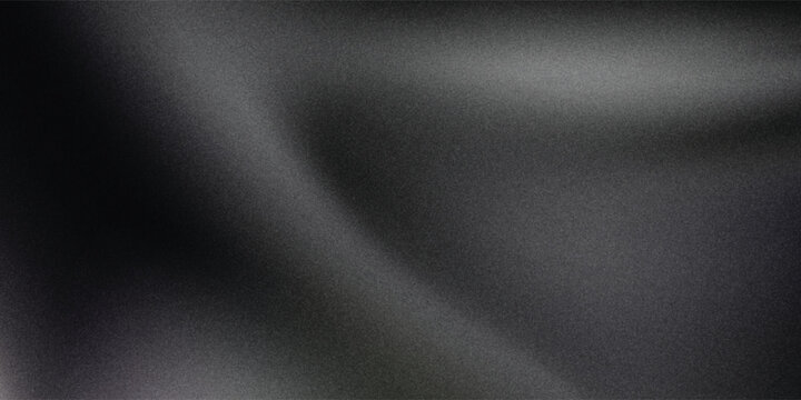 Sandblasted or brushed titanium or steel metal surface  the light reflection of the curved lines creates a smooth gradation on the dark black metallic background