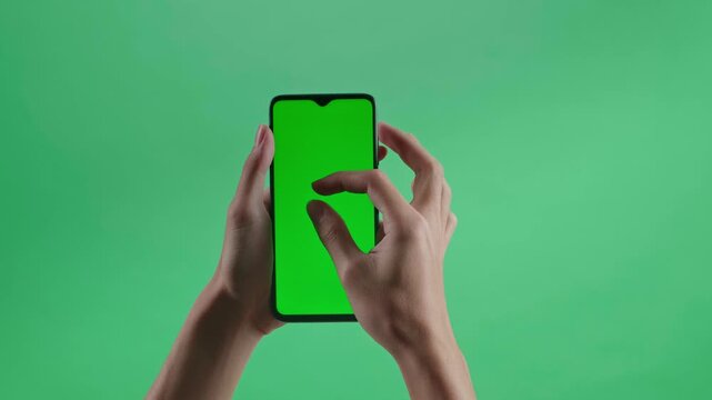 Smartphone hand zoom on green screen