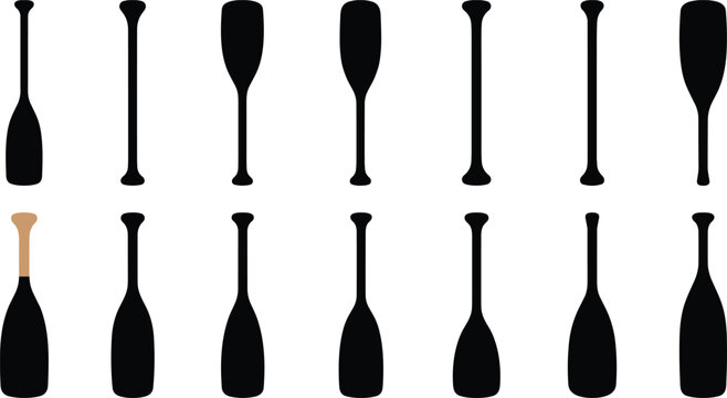 Several oars are arranged horizontally in two rows on a surface.
