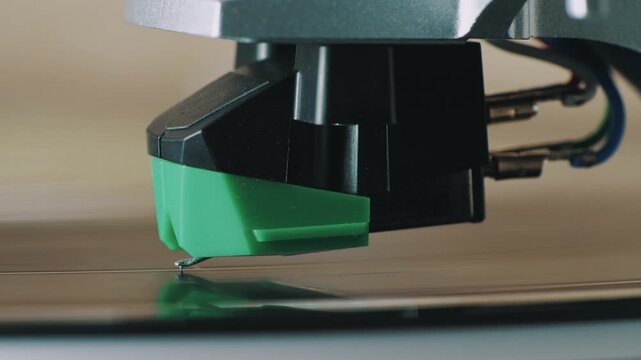 Vinyl Record Player Needle Stylus Lowering Onto LP Record, Turntable Cartridge Playing Analog Music, HiFi Audio, Retro Sound Technology, Macro Close Up.