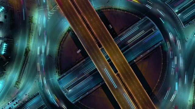 Intersection view above , Expressway top view, Road traffic an important infrastructure, car traffic transportation above intersection road in city night of advanced innovation, financial technology