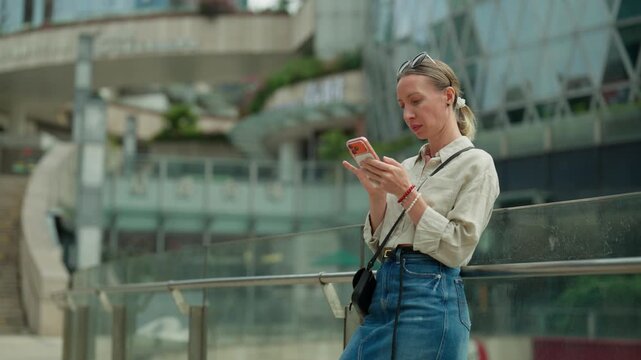 Use smartphone for be online, portrait of woman in metropolis, lady in city. Modern technology for communication and online work, phone addiction and mobile gadget overuse, roaming in traveling