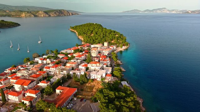 Cinematic aerial panorama of Ermioni peninsula overlooking the calm Mediterranean coastline, Argolis, Greece