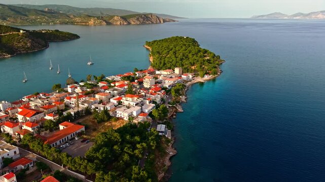 Wide aerial landscape of Ermioni peninsula during golden hour with expansive Mediterranean sea views, Argolis, Greece