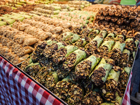 Typical Maltese sweets: chocolate biscuits, Imqaret, and Kannoli (Cannoli), Marsaxlokk, Republic of Malta, Europe