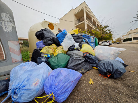 garbage bags in the street and overflowing containers, S&acute;Estanyol de Migjorn, Llucmajor, Majorca, Balearic Islands, Spain