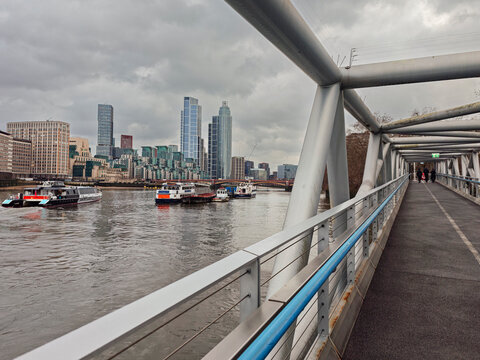 photographing the City from a bridge next to the River Thames, London, Great Britain
