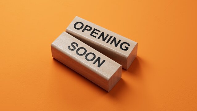 Opening soon symbol. Concept word Opening soon on wooden blocks. Business and Opening soon concept. Copy space.3D rendering