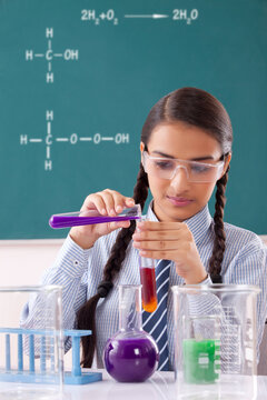 Teenage Girls doing experiment in laboratory