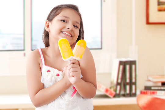 Girl eating ice cream popsickles