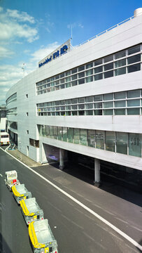 Dusseldorf Airport terminal building. The "Dusseldorf DUS" logo is visible on the top of the building.