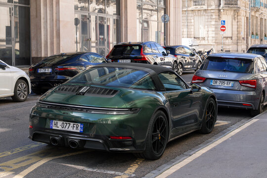 Nancy, France - July 6th 2026 : View on a green Porsche 992 Targa 4GTS finished in Oak Green Metallic parked on a street surrounded by other cars.