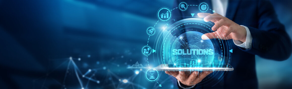 Business consultant using tab analysing Solutions and enterprise service strategies, process improvement initiatives, operational efficiency and digital transformation.