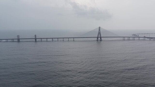 Cinematic drone truck right shot of Bandra Worli Sea Link bridge structure, Mumbai