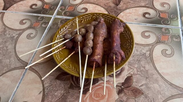 Traditional Indonesian Satay Angkringan Skewers on Plate