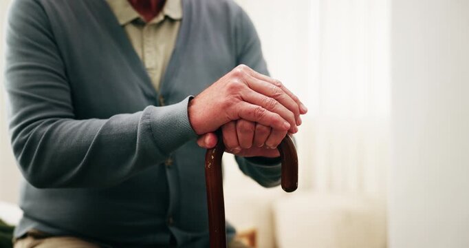 Hands, old man and relax at house with walking stick, mobility support and recovery from injury. Cane, balance and senior person with disability, muscle stiffness and stability from parkinson disease