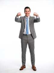 Fototapeta premium Full-body studio portrait of triumphant businessman in gray suit with arms raised and fist pump on white background