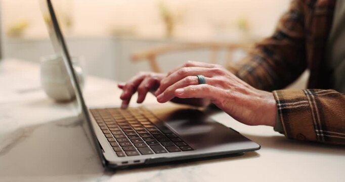 Hands, home and man typing on laptop, internet and writing email for communication or remote work. House, online and person on computer for project update, schedule and research for freelancer career