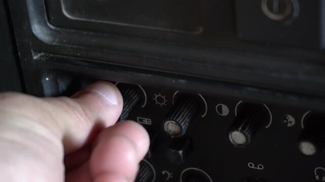 Experiencing nostalgic entertainment on an outdated vintage television, evoking retro technology and classic home media.