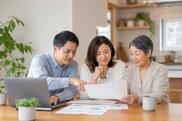 Fototapeta premium Family Reviewing Household Budget Together