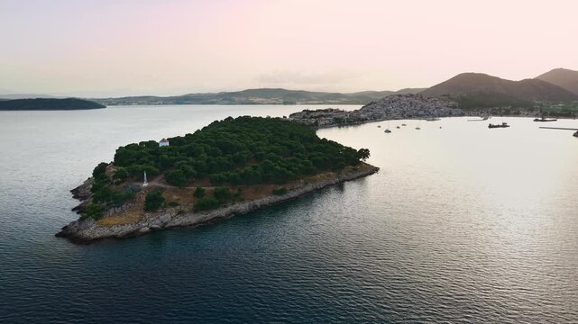 Panoramic aerial view over the Aegean Sea overlooking the picturesque peninsula of Ermioni, Greece, at sunset.