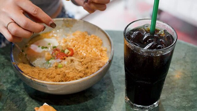 Asian Breakfast with Rice Congee Fried Dough and Iced Coffee