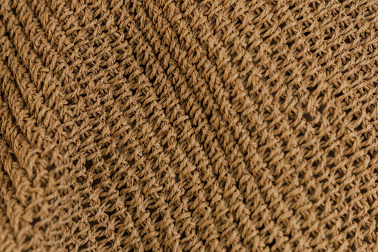 Texture background shows weaving pattern made from natural fibers in a craft setting