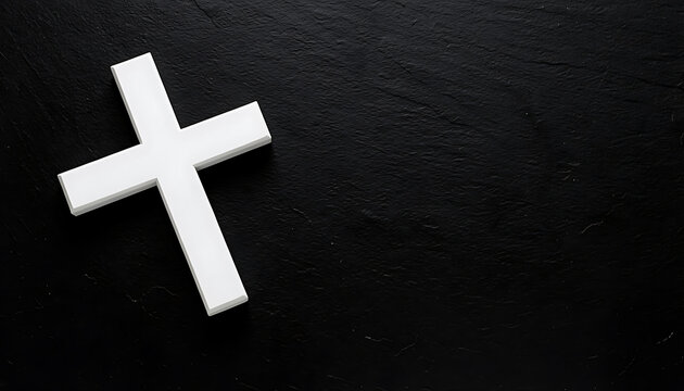 White wooden cross on black textured background with copy space