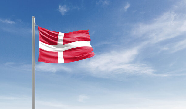 Denmark national flag waving in the sky.