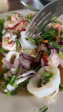 Fork in Thai spicy fresh seafood salad
