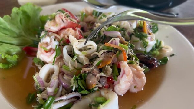Fork in Thai spicy fresh seafood salad