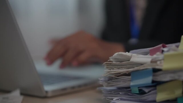 Organized Office Paperwork with Color-Coded Tabs Supporting Efficient Business Documentation