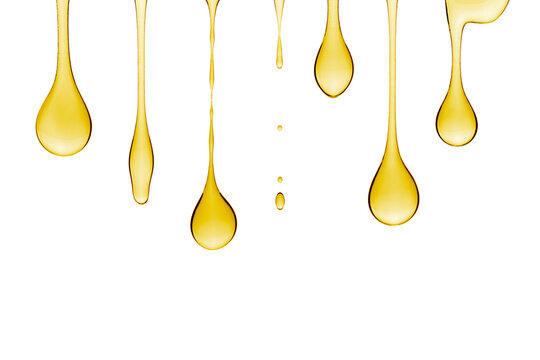 Golden drops of cosmetic gel dripping down, isolated on transparent background. PNG Image.