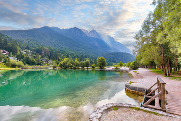 Naklejka premium Gorgeous landscape on Jasna lake with beautiful reflections of the mountains.