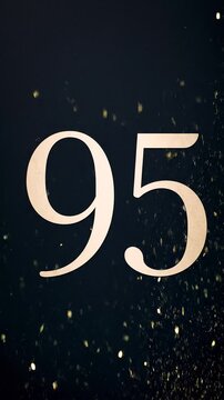 Gold Glitter Blow‑Away Reveal of Number 95 on Solid Background
