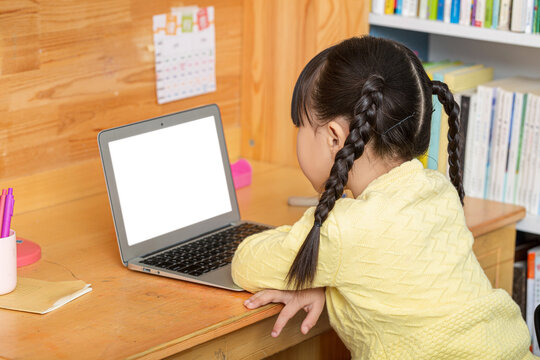 cheerful Asian girl using laptop for online class at home, distance learning and e-education concept.