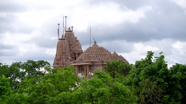 Wide view with green tree tops of the Jain Temple at Manuabhan Tekri Bhopal Madhya Pradesh