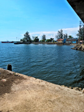 Defocused view of the coastal harbour and sea in Pulau Baai, Bengkulu.