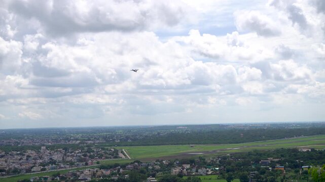 Shot of an aircraft take-off from Raja Bhoj Airport Bhopal Madhya Pradesh with beautiful clouds in the background